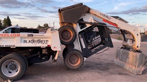 climbing into skid steer|how to use a skid loader.